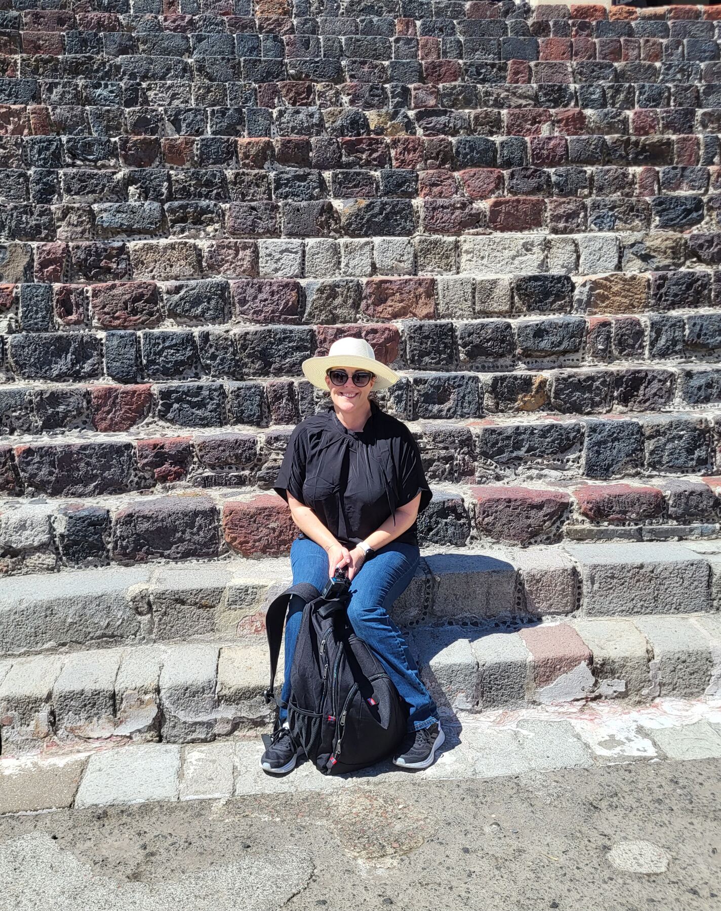 Shannon sitting on the steps of the Pyramid of the Sun at Teotihuacán