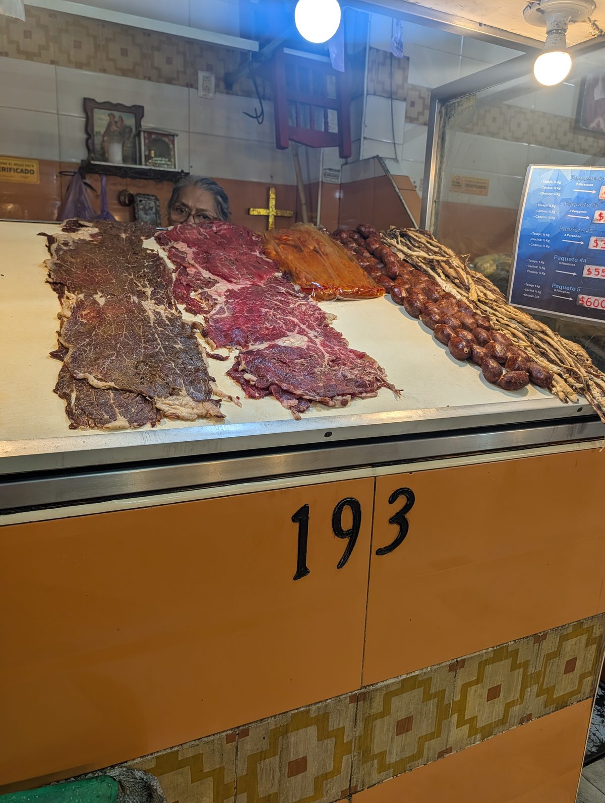 Tasajo, cecina enchilada and chorizo laid out at stall 193 in Pasillo de Humo, Oaxaca